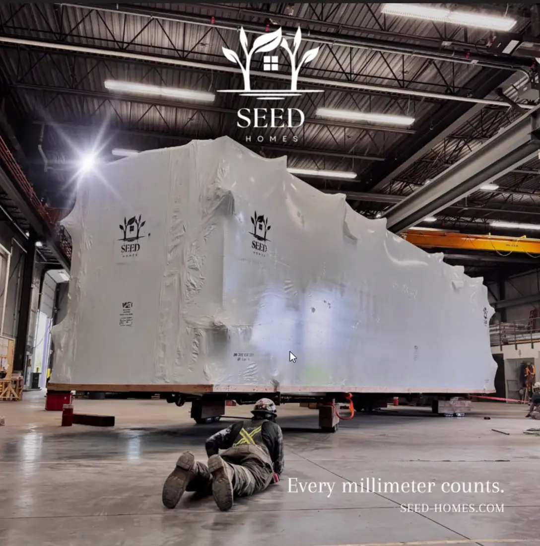 A folded SEED home wrapped for transport inside the factory